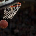 Basketball hoop and ball on a court