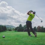 Golf ball on tee at a course - beginner golf rules guide